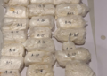Cocaine tucked into trolley bag handle, plastic supports; Ugandan flyer held at Ahmedabad airport